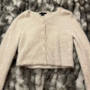 Cropped long sleeve fuzzy sweater